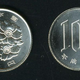 Illustration for article titled How One Coin Saved Arcades In Japan and Another Killed Them in the U.S.
